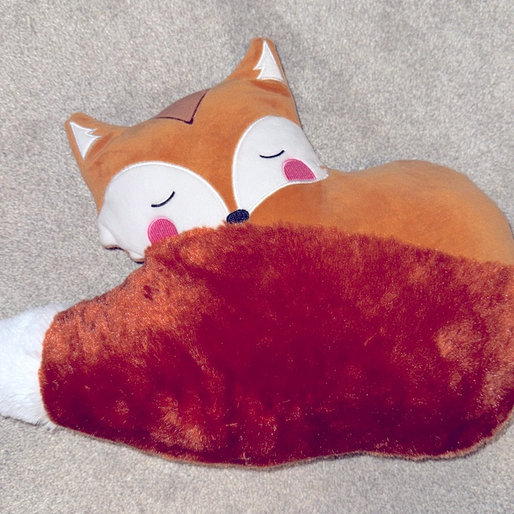 Microwaveable stuffed fox pillow can be warmed up